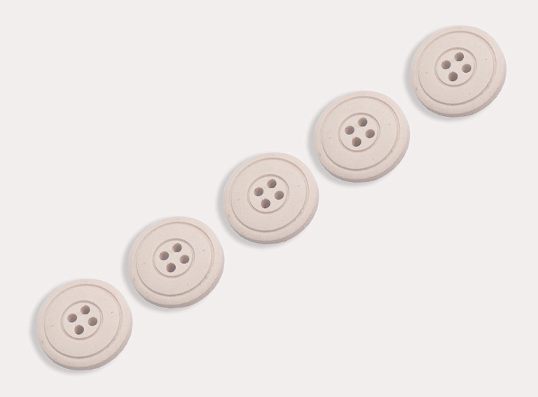 Фото ткани Пуговица круглая, цвет - молочный