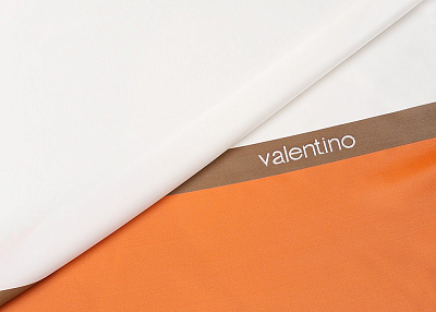 Фото ткани Подкладочная ткань тип Valentino с рисунком (купон), цвет - белый и оранжевый
